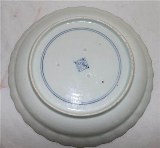 A rare Kakiemon moulded blue and white plate, c.1750-80, 16.5-21cm (5)